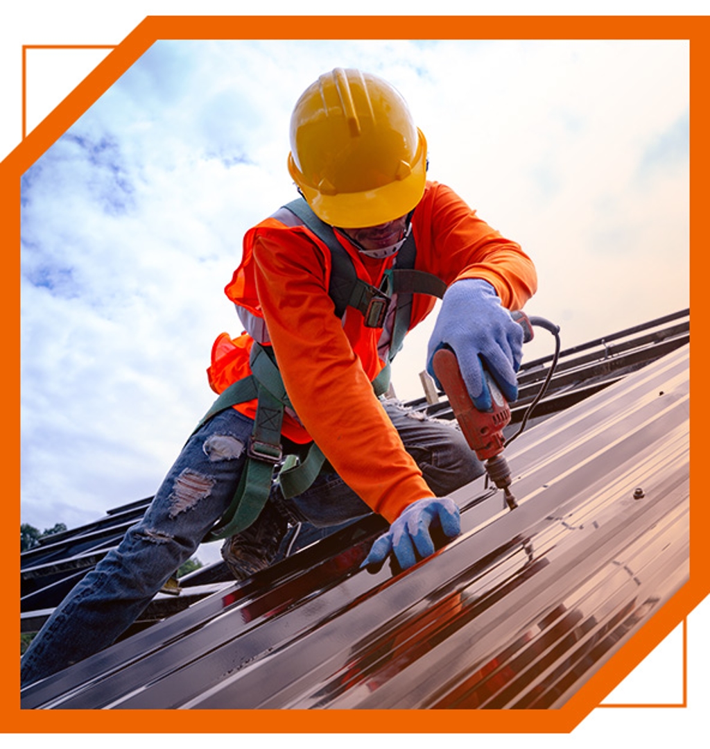 Recon Roofing technician installing a metal roof